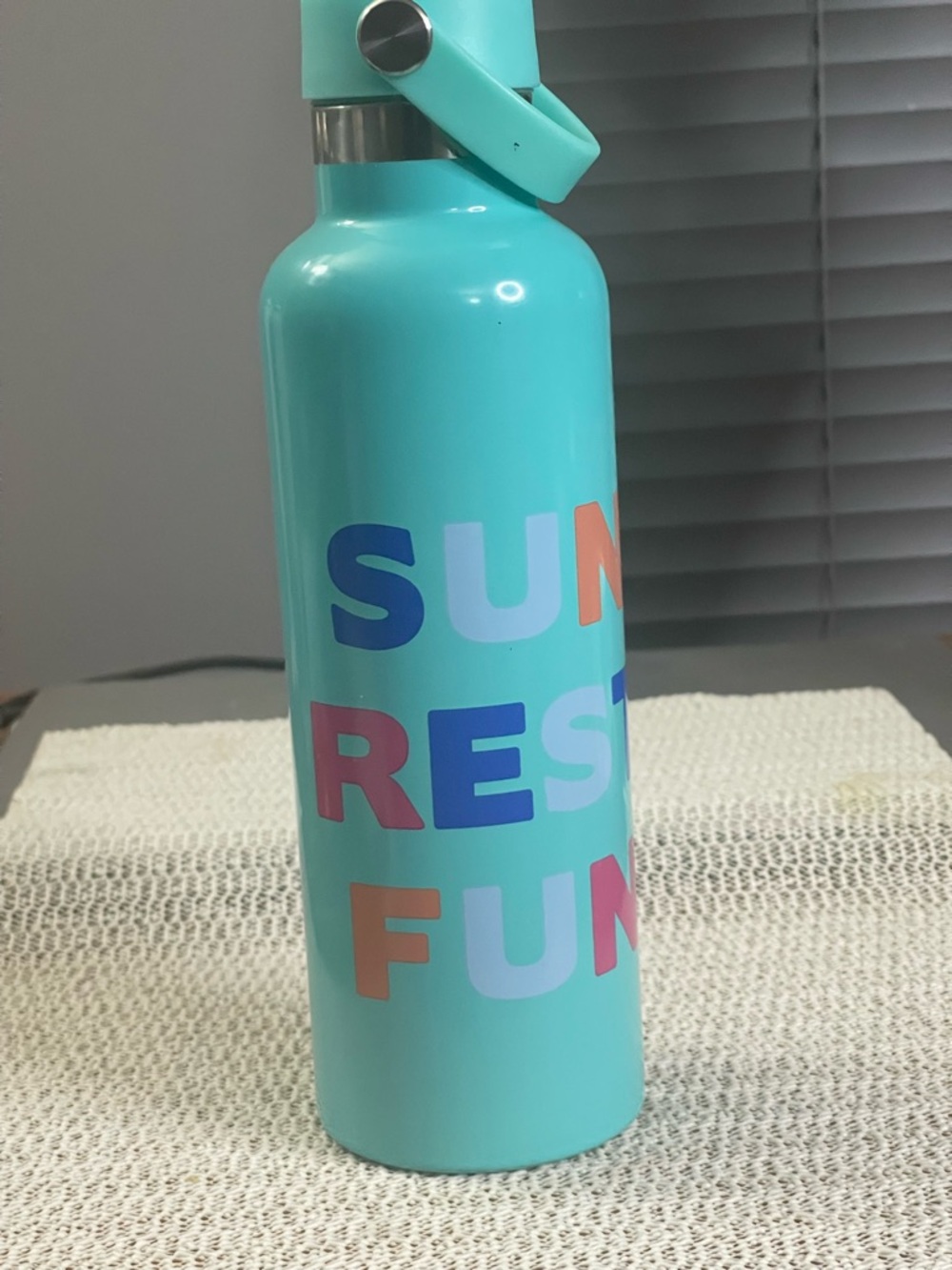22oz copper vacuum insulated water bottle featuring "SUMMER FUN" text on the sid